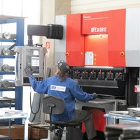 one machinist operates a bending machine