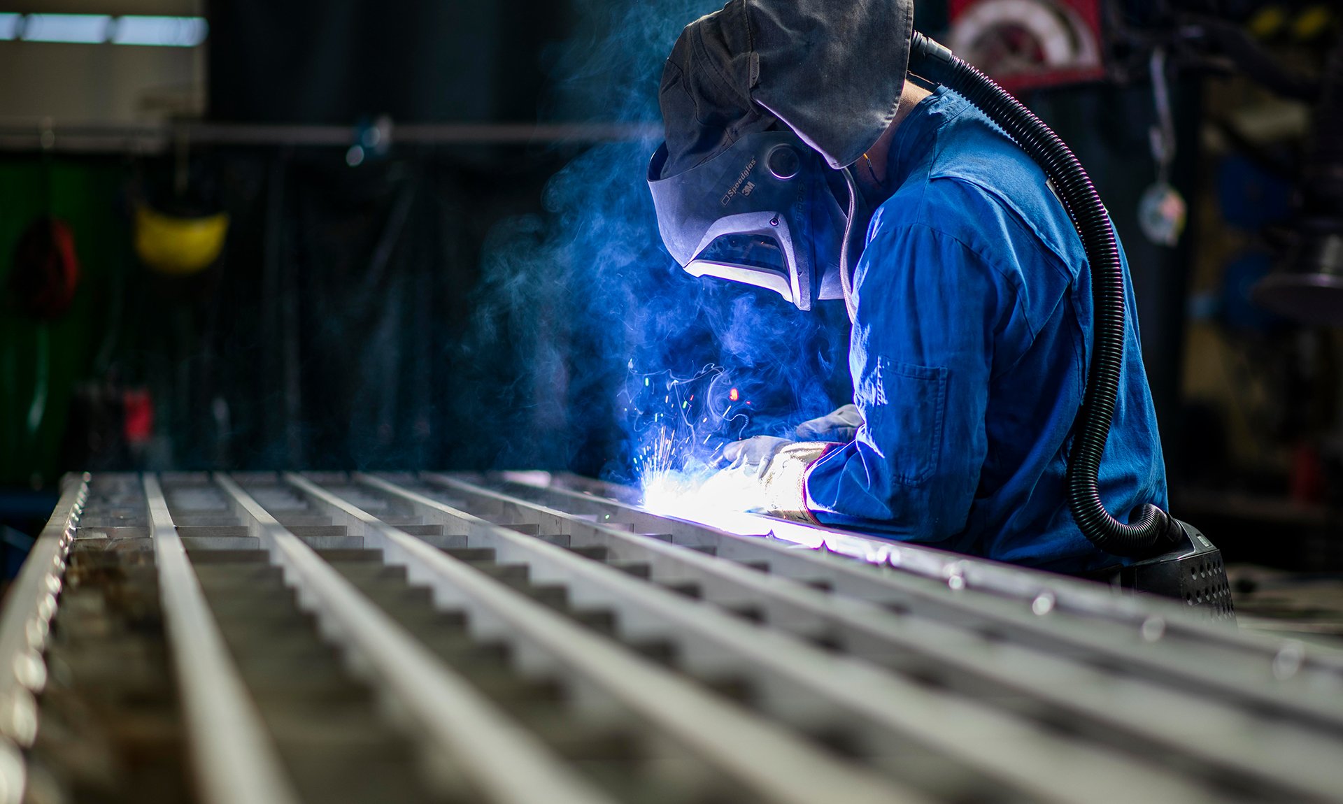An image shows a working welder